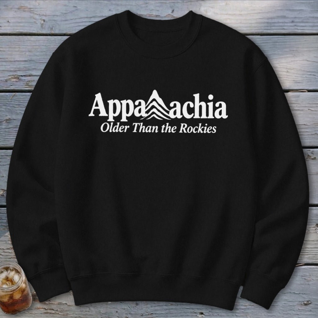 Black sweatshirt with white "Appalachia" text and mountains, and "Older Than the Rockies".