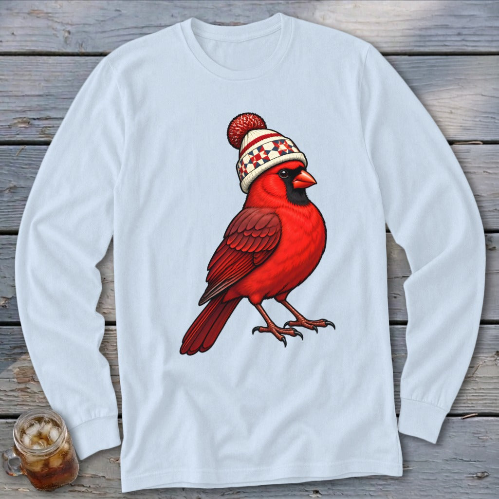 Light gray long-sleeve t-shirt featuring a centered illustration of a red cardinal wearing a winter hat.