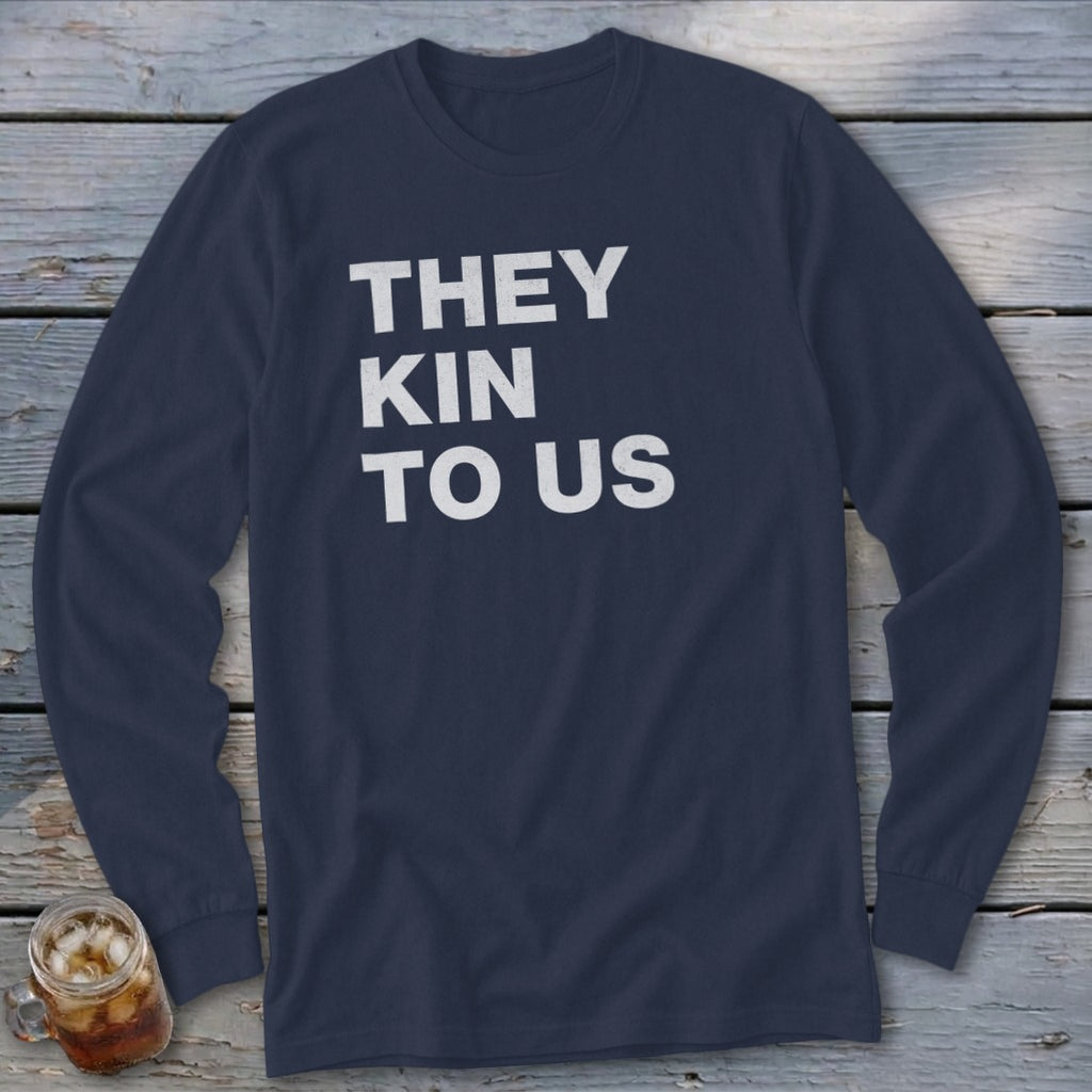 Navy long-sleeve shirt with white text "THEY KIN TO US"