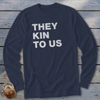 Navy long-sleeve shirt with white text "THEY KIN TO US"