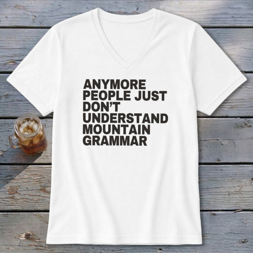 White v-neck t-shirt with black text reading "Anymore people just don't understand mountain grammar."