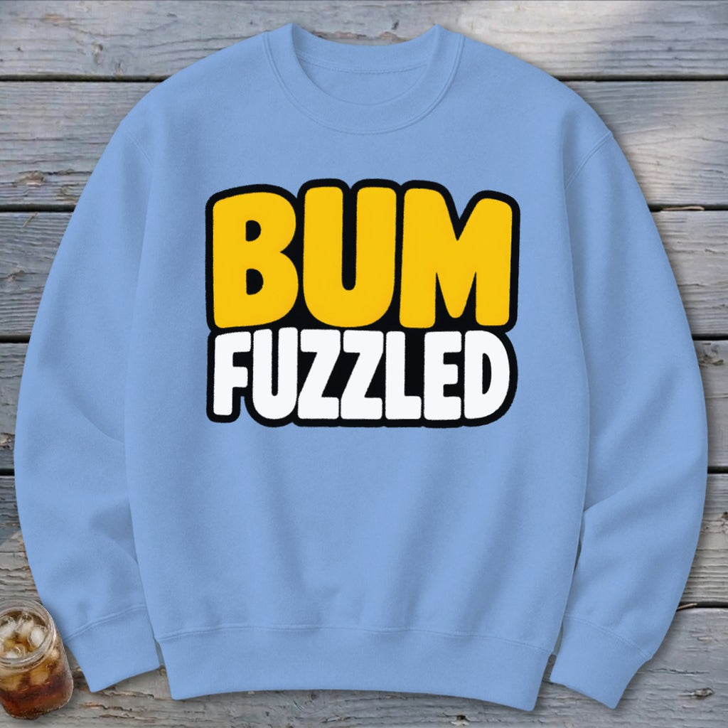 Light blue crewneck sweatshirt featuring the text BUM FUZZLED in bold yellow and white letters.