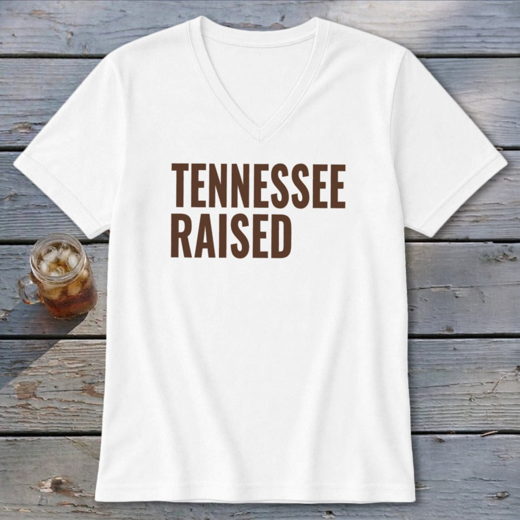 White V-neck t-shirt with "TENNESSEE RAISED" printed in brown.