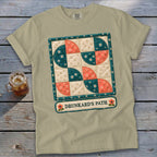 T-shirt with a Drunkard's Path quilt pattern and floral embellishments.