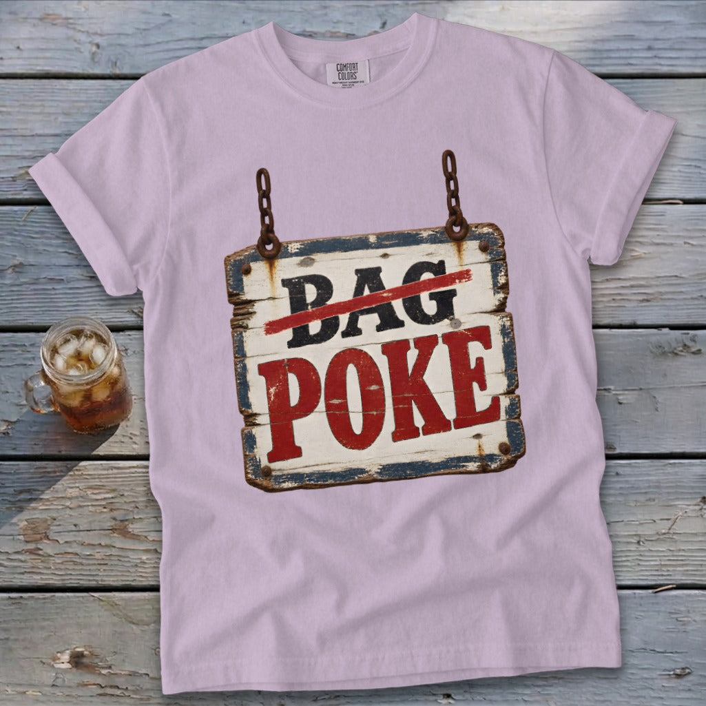 Lavender t-shirt featuring a distressed wooden sign graphic that reads "Bag Poke" with the word "Bag" crossed out in red.