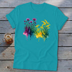 Turquoise t-shirt with watercolor floral design in purple and yellow.