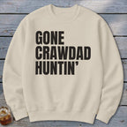 Cream sweatshirt with black text reading "GONE CRAWDAD HUNTIN'".