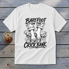 White t-shirt graphic with "Barefoot on the Crick Bank" text and bare feet.