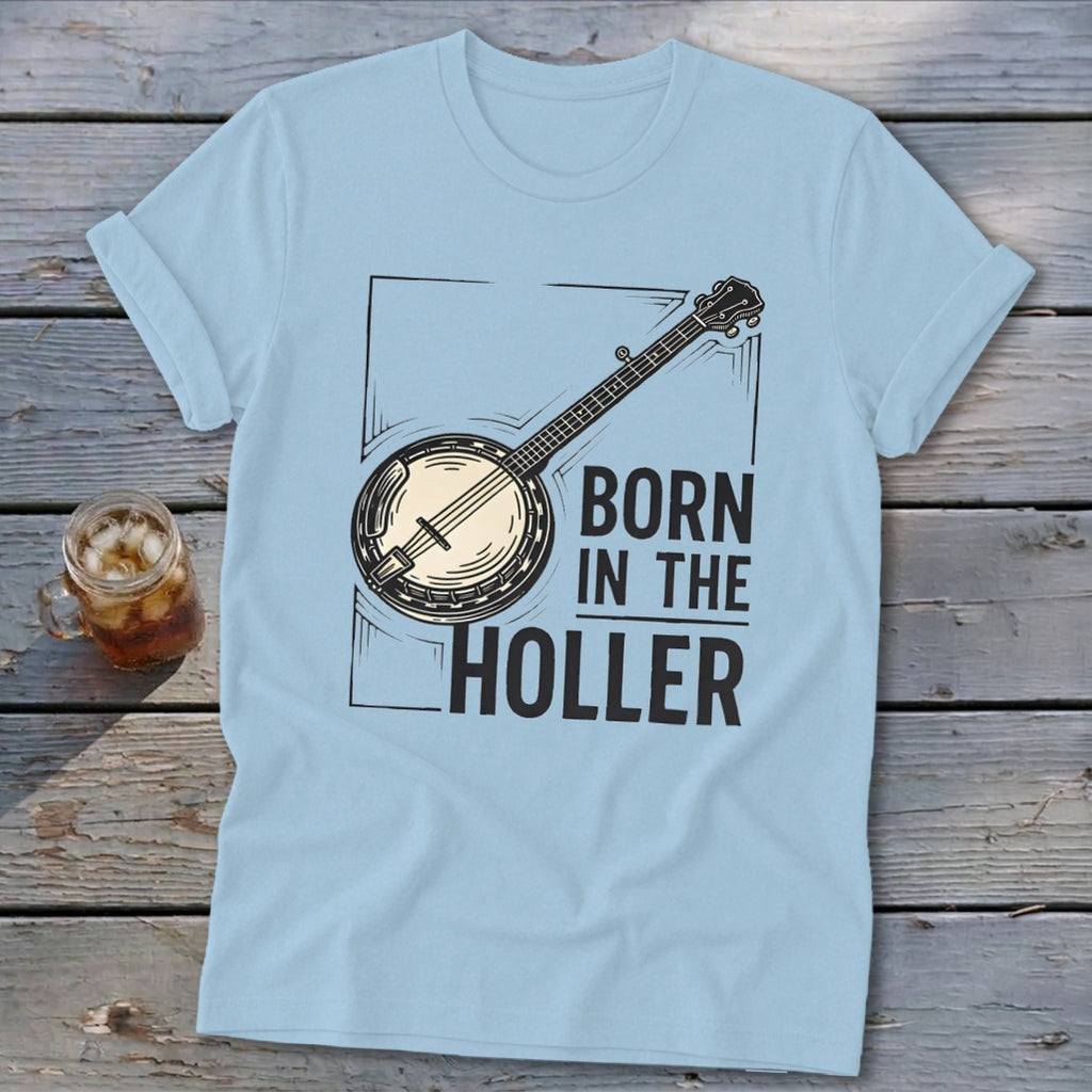 Light blue t-shirt with banjo graphic and text "BORN IN THE HOLLER".