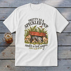 White t-shirt graphic with text "PRETTY AS A SPECKLED PUP under a red wagon".