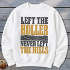 White sweatshirt with text "LEFT THE HOLLER NEVER LEFT THE HILLS" and mountain graphic.