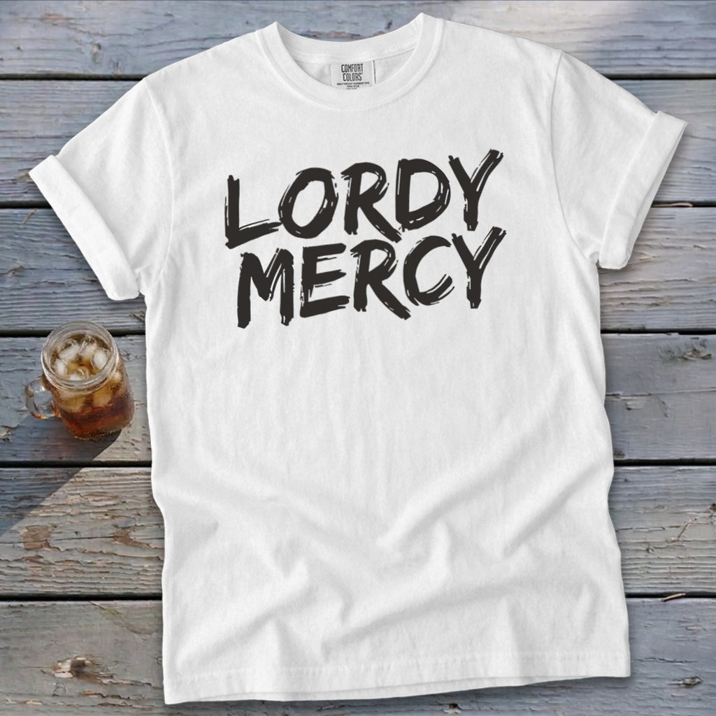 White t-shirt with black "LORDY MERCY" text and a glass of iced tea.