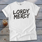 White t-shirt with black "LORDY MERCY" text and a glass of iced tea.