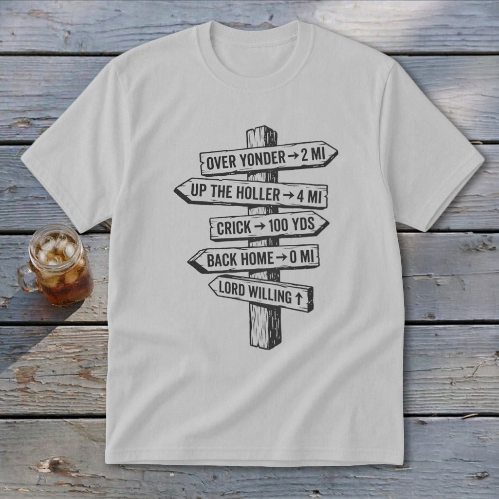 A light gray short-sleeved t-shirt featuring a black graphic of a wooden signpost with directional distances.