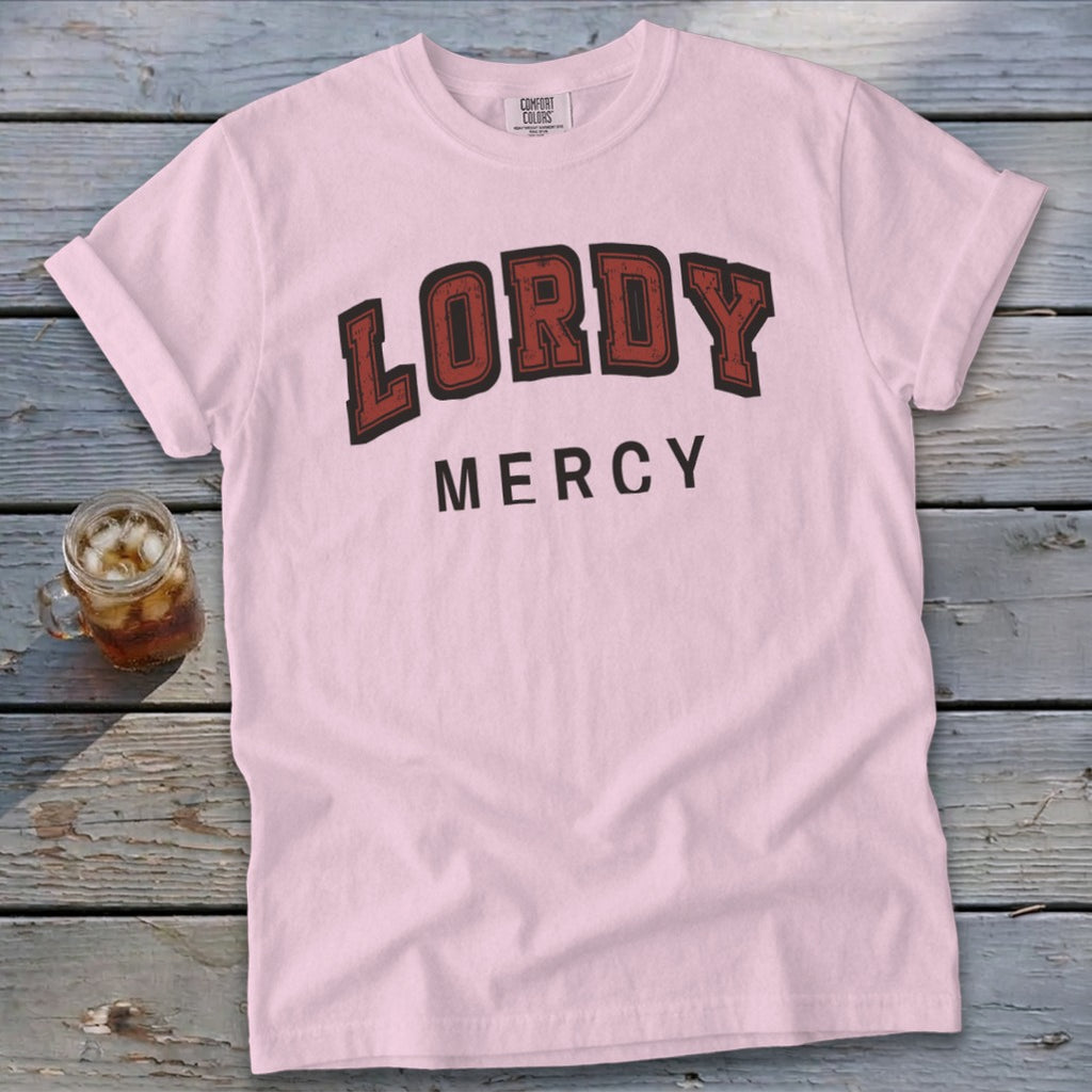 Pink t-shirt with "LORDY MERCY" text in distressed red and black lettering.