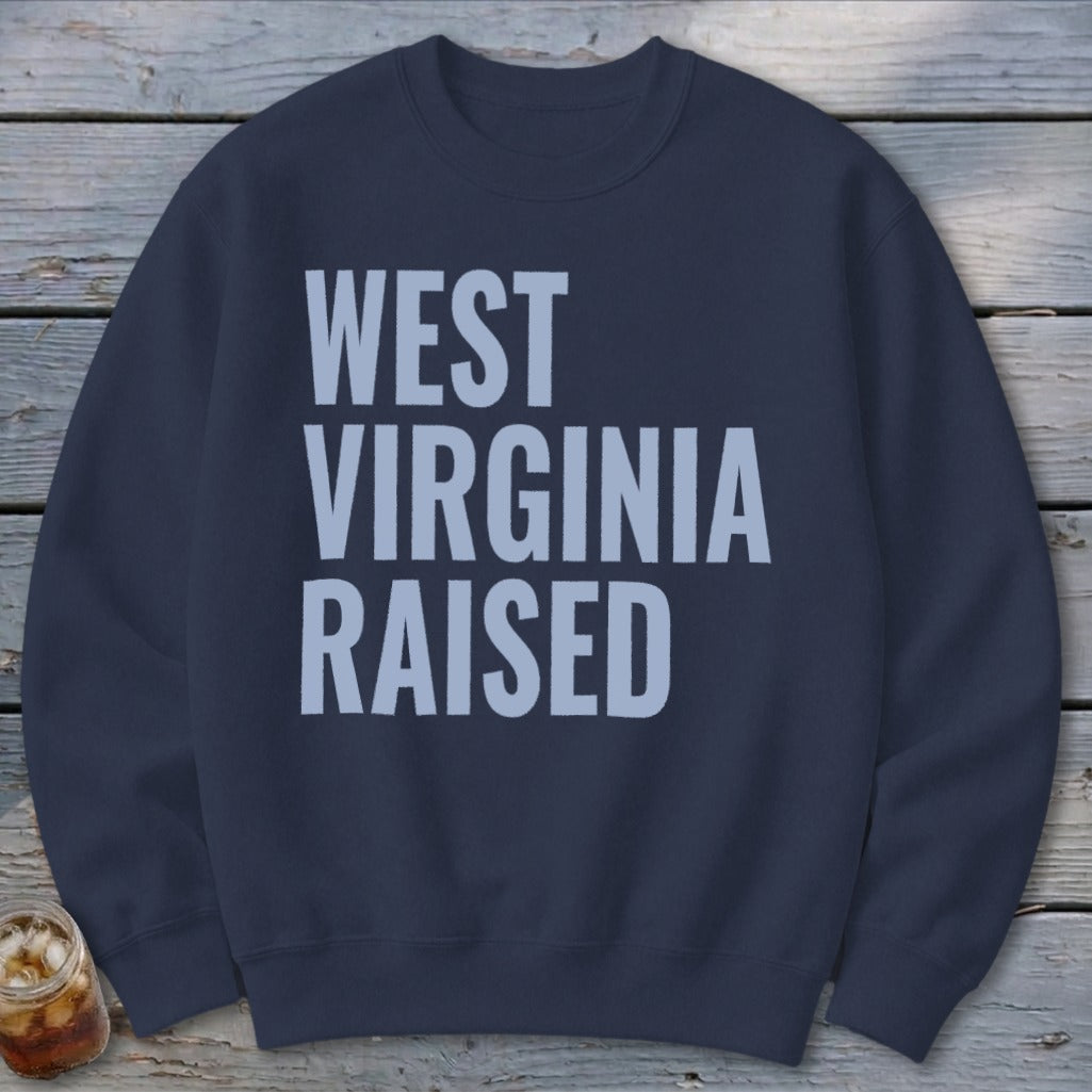 Navy sweatshirt with "WEST VIRGINIA RAISED" text in light blue on the front.