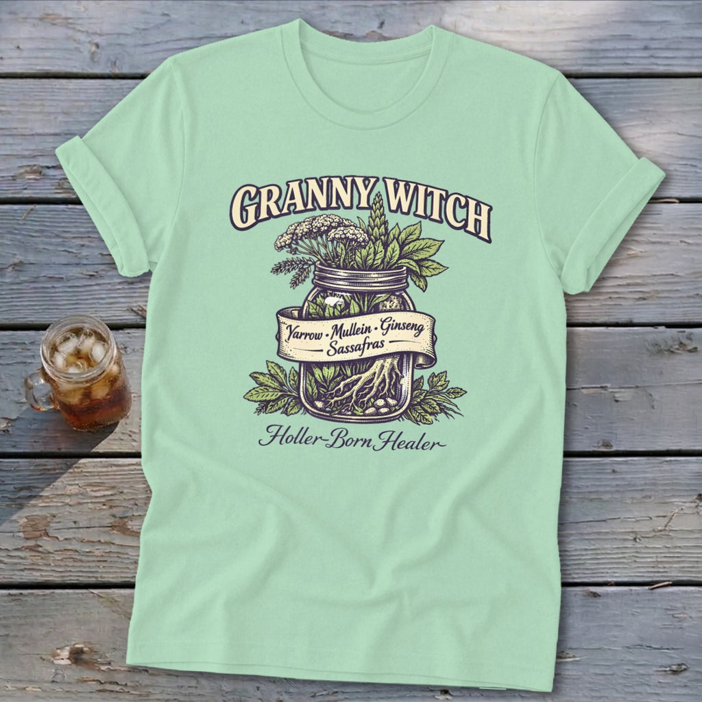 Mint t-shirt with Granny Witch text and jar illustration of herbs: Yarrow, Mullein, Ginseng, Sassafras.