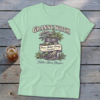 Mint t-shirt with Granny Witch text and jar illustration of herbs: Yarrow, Mullein, Ginseng, Sassafras.