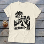 Cream t-shirt with black graphic of a house, trees, fence, and text "OLD HOME PLACE".
