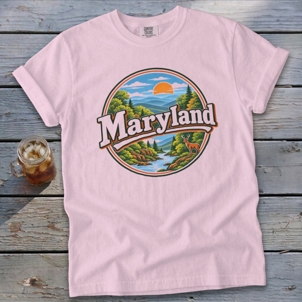 Pink t-shirt with circular Maryland landscape graphic featuring a deer and river.