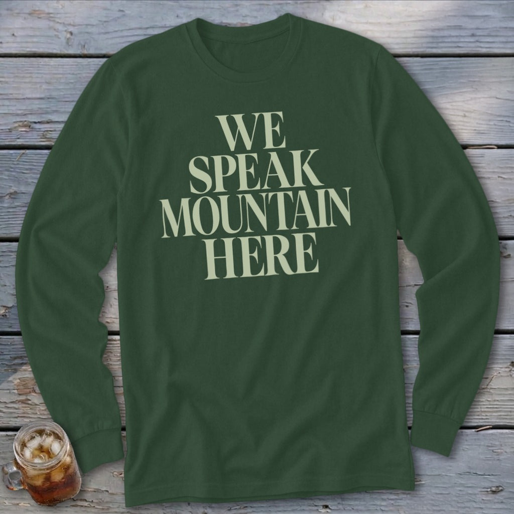 Long sleeve dark green shirt with beige text "WE SPEAK MOUNTAIN HERE".