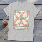 White t-shirt featuring a Double Wedding Ring quilt block and text.