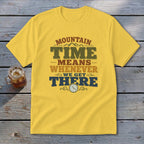 Yellow t-shirt with "Mountain Time Means Whenever We Get There" text and a clock graphic.