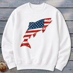 A white crewneck sweatshirt featuring a distressed graphic of a jumping fish patterned with the American flag.