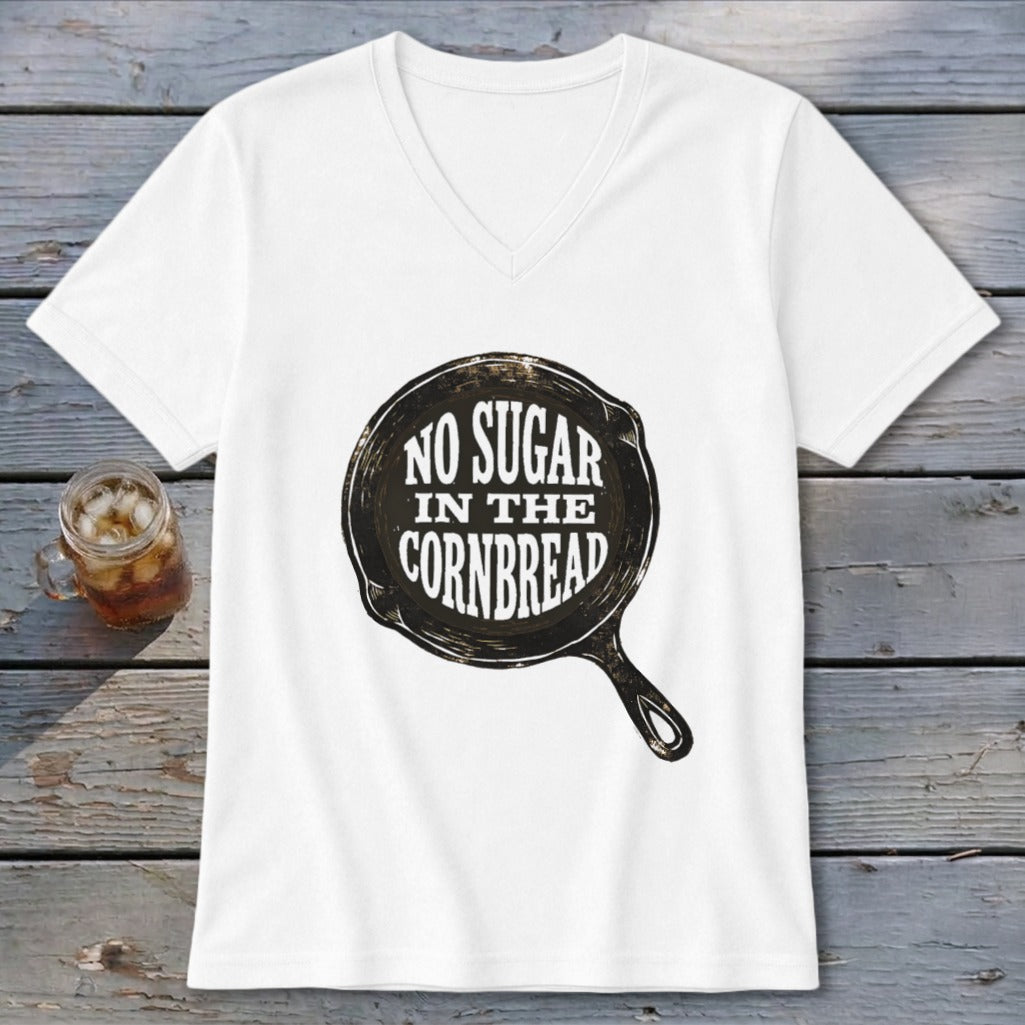 White v-neck t-shirt with "NO SUGAR IN THE CORNBREAD" graphic in a skillet.