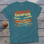 Teal t-shirt with "almost heaven" text and a colorful landscape graphic.