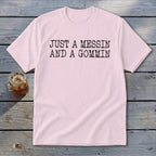 Pink t-shirt with black text "JUST A MESSIN AND A GOMMIN".