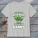 Light grey V-neck t-shirt featuring green text that reads If you see me in the woods I'm huntin' ramps above and below an illustration of three ramps.