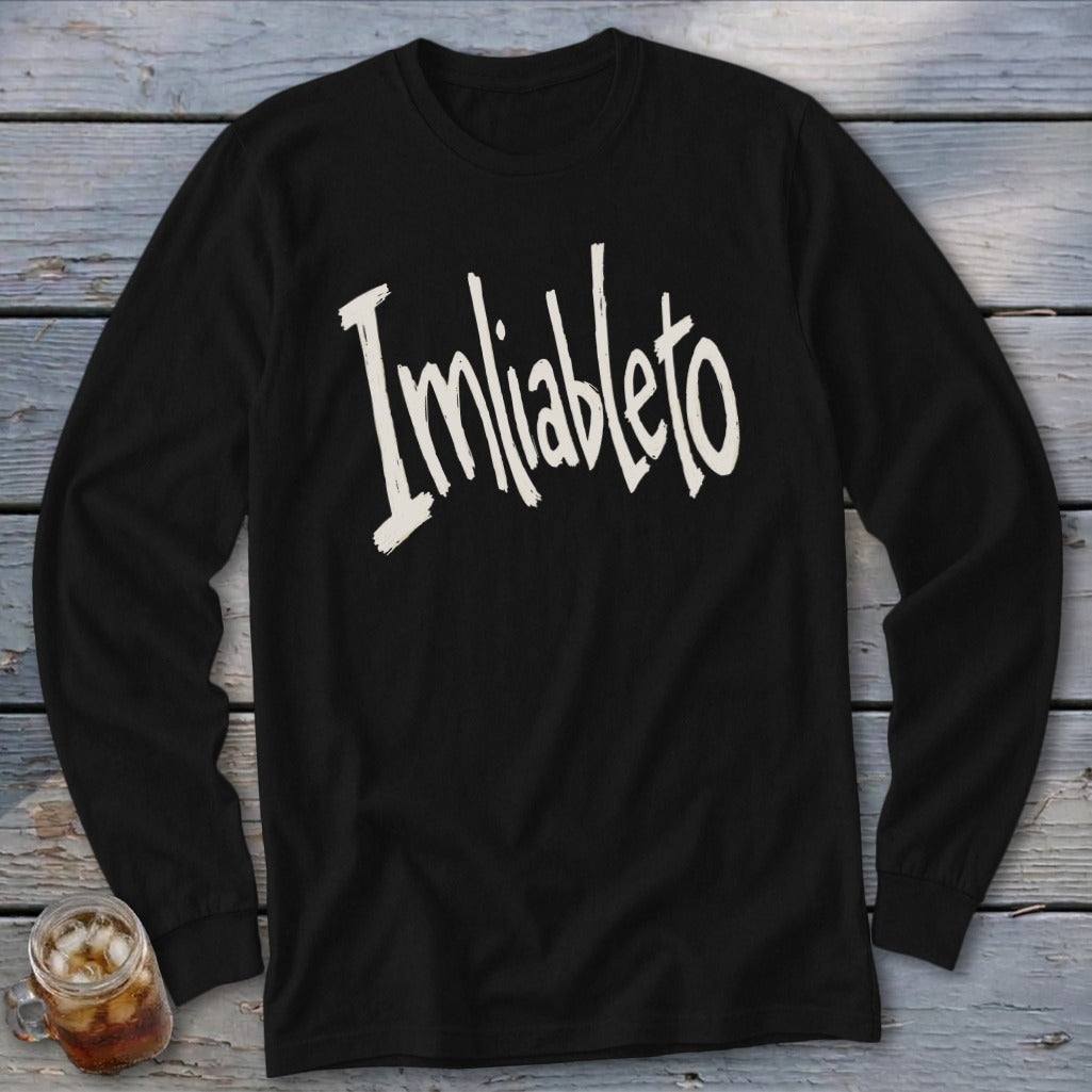 Black long-sleeve shirt with "Imliableto" in distressed white text.