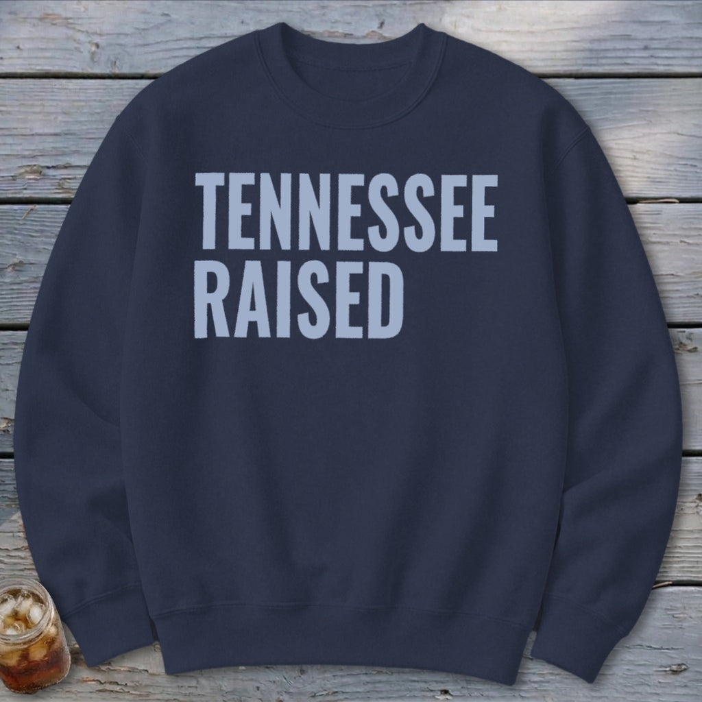 Navy crewneck sweatshirt with "TENNESSEE RAISED" text in light blue.
