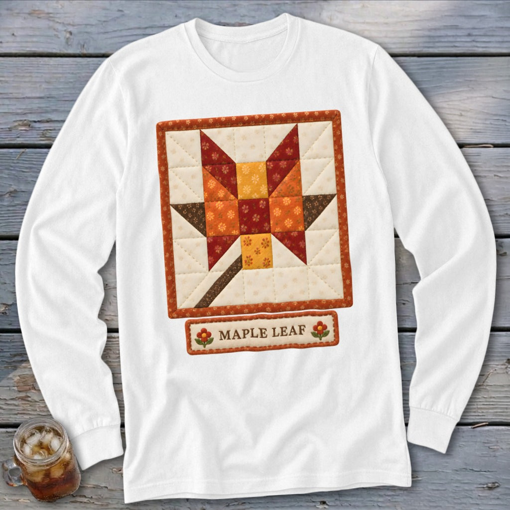 White long-sleeve shirt with a quilted maple leaf block design and "MAPLE LEAF" text.