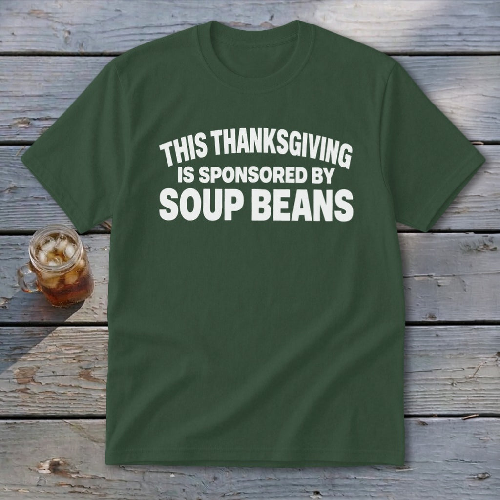 A dark green t-shirt with white text that reads, "THIS THANKSGIVING IS SPONSORED BY SOUP BEANS."