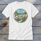 White t-shirt with circular graphic featuring "Georgia" over a mountain landscape and deer.