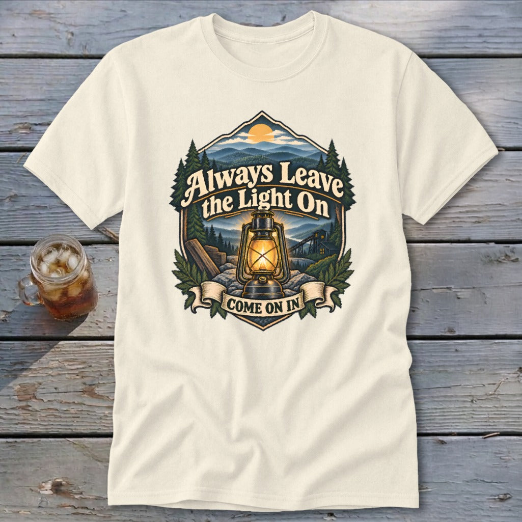 Cream t-shirt featuring a lantern with "Always Leave the Light On" and "Come On In".