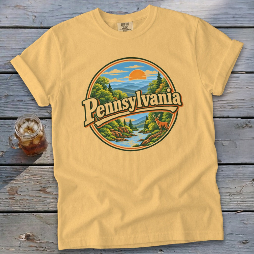 Yellow t-shirt with circular Pennsylvania landscape graphic and deer.