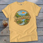 Yellow t-shirt with circular Pennsylvania landscape graphic and deer.
