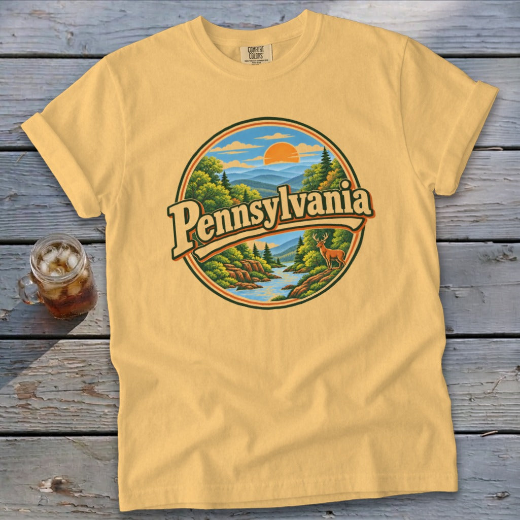 Yellow t-shirt with circular Pennsylvania landscape graphic and deer.