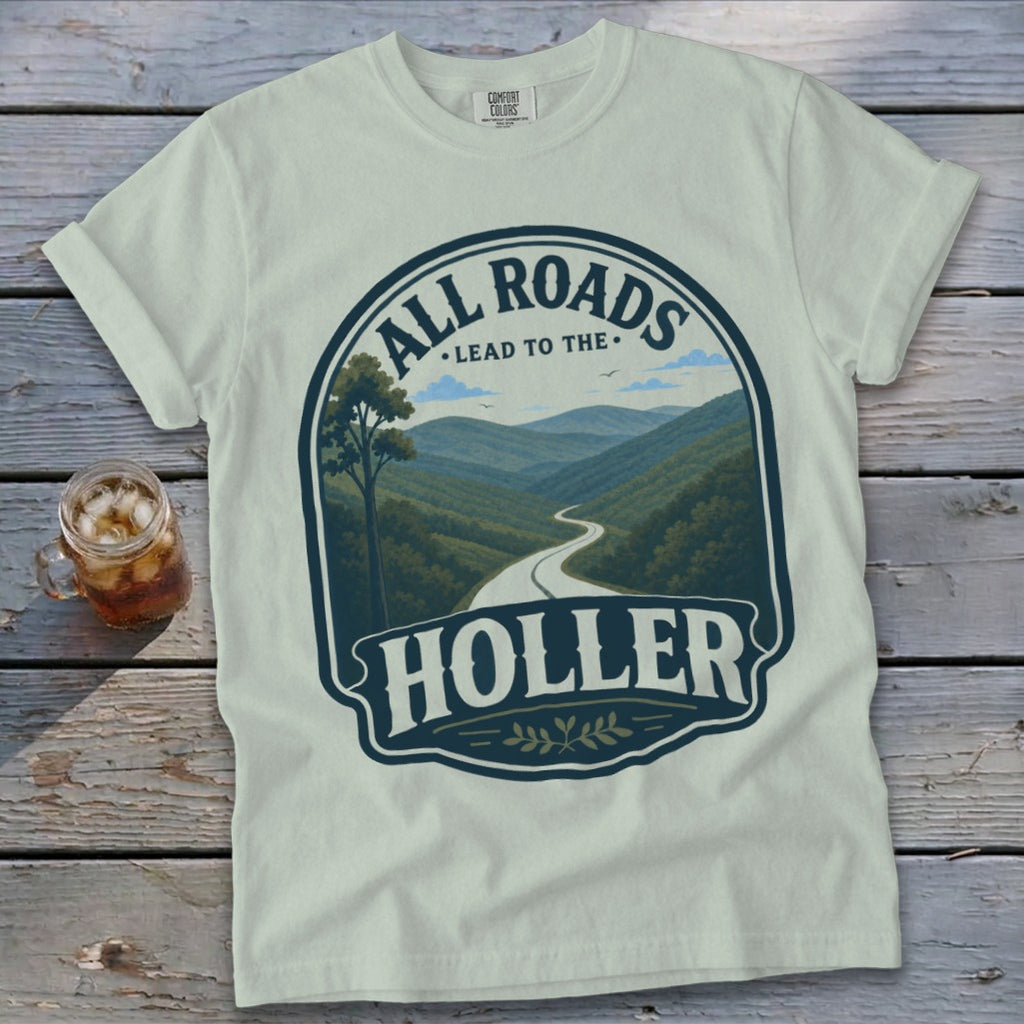 Cream t-shirt with graphic "All Roads Lead to The Holler" and scenic mountain road.