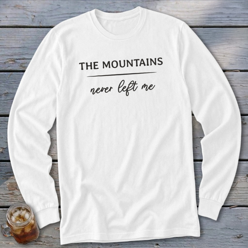 White long-sleeve shirt with "THE MOUNTAINS never left me" text.