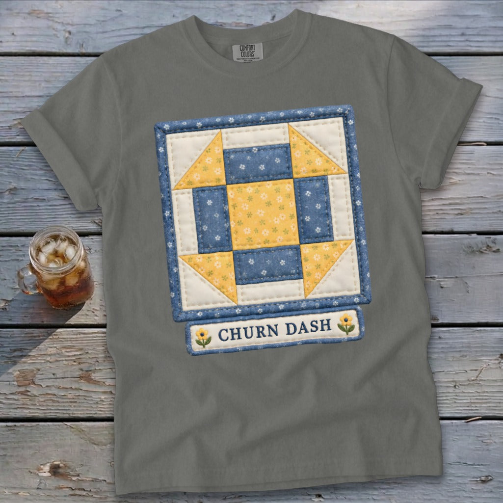 Grey t-shirt with a quilt block design and "CHURN DASH" text below.