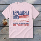 Light pink t-shirt featuring a distressed American flag graphic and the text Appalachia, 13 States, One Mountain Range, One Free Country.