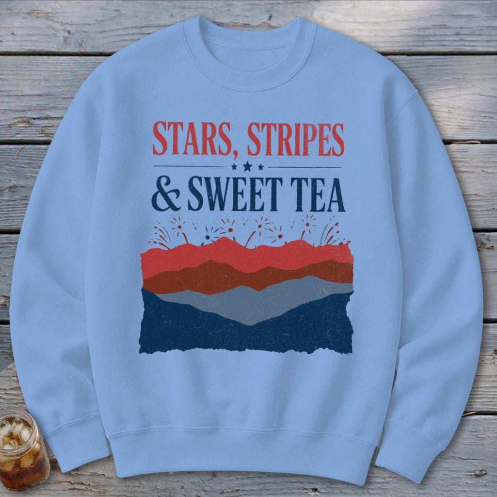 Light blue crewneck sweatshirt featuring the red, white, and blue graphic text Stars, Stripes, and Sweet Tea.