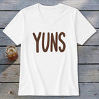 White v-neck t-shirt with "YUNS" printed in brown letters.