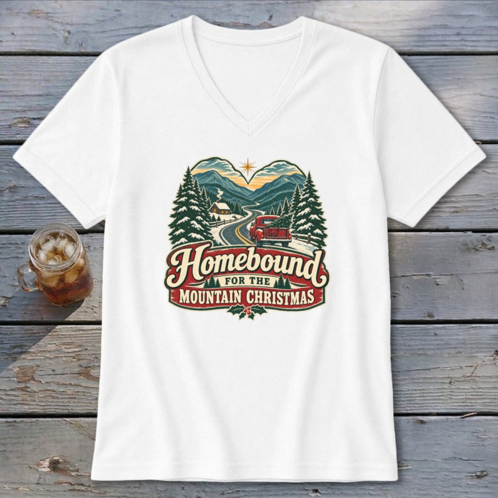 T-shirt with "Homebound for the Mountain Christmas" text and a scenic winter mountain village graphic.