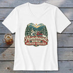 T-shirt with "Homebound for the Mountain Christmas" text and a scenic winter mountain village graphic.