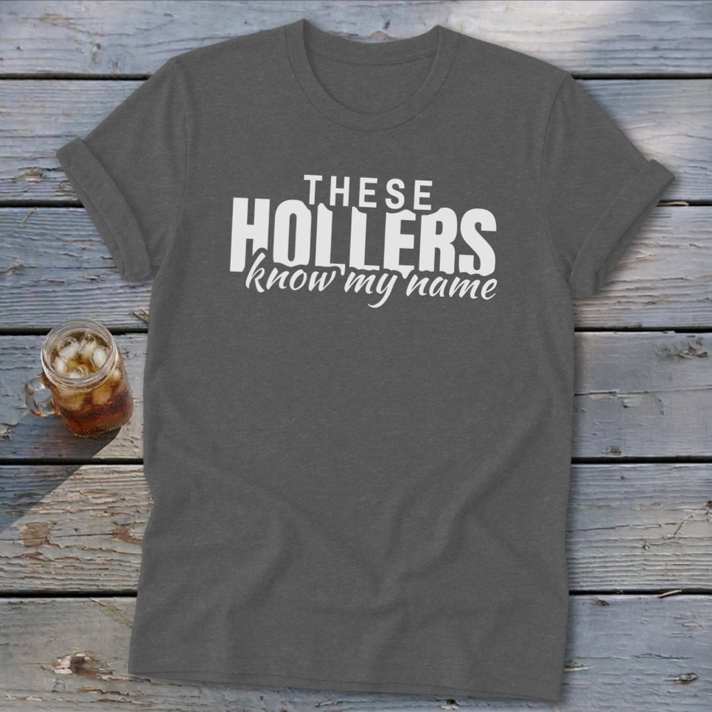 Grey t-shirt with white text "THESE HOLLERS know my name"